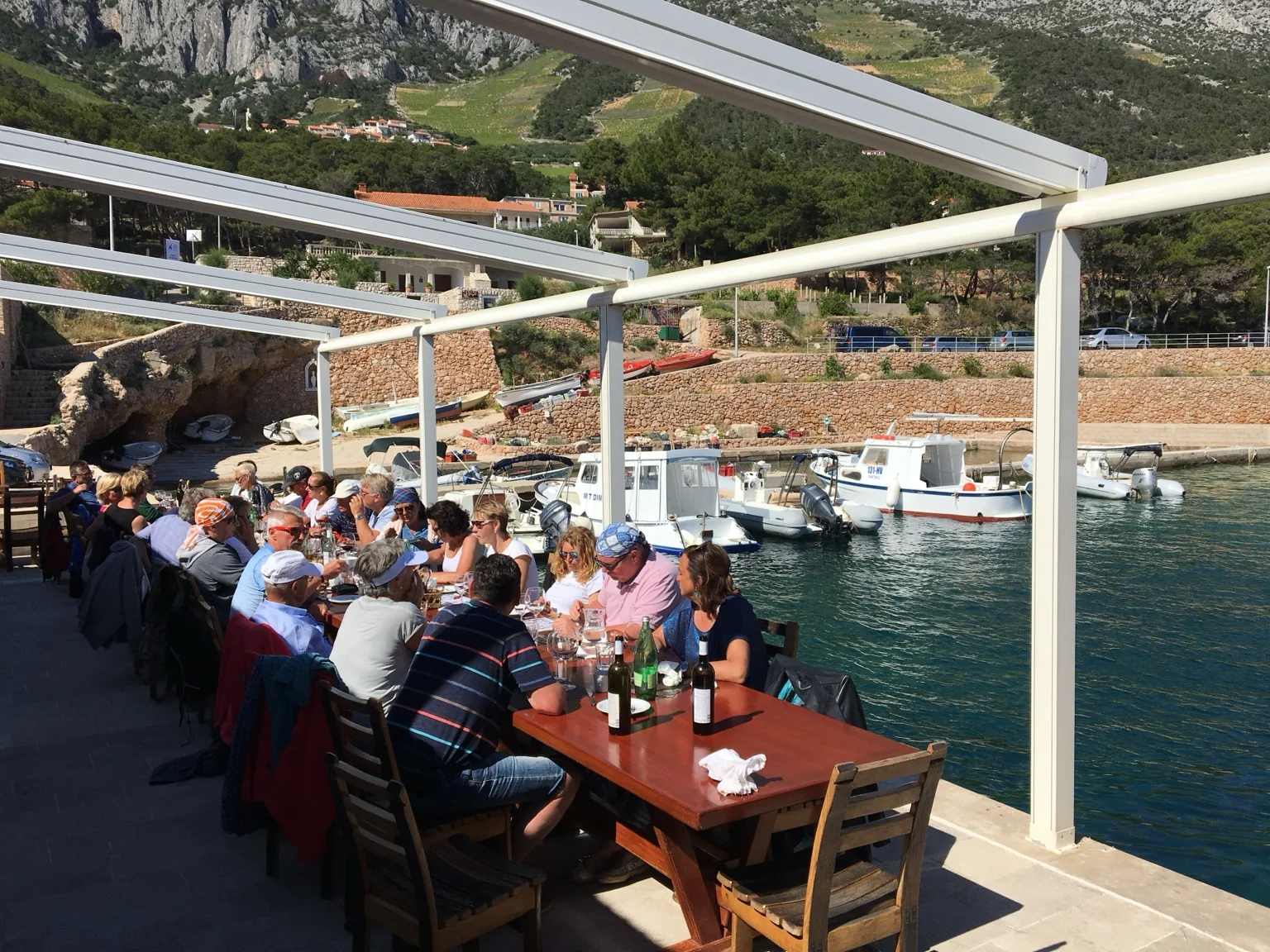 Hosted group lunch beside a Croatian harbour