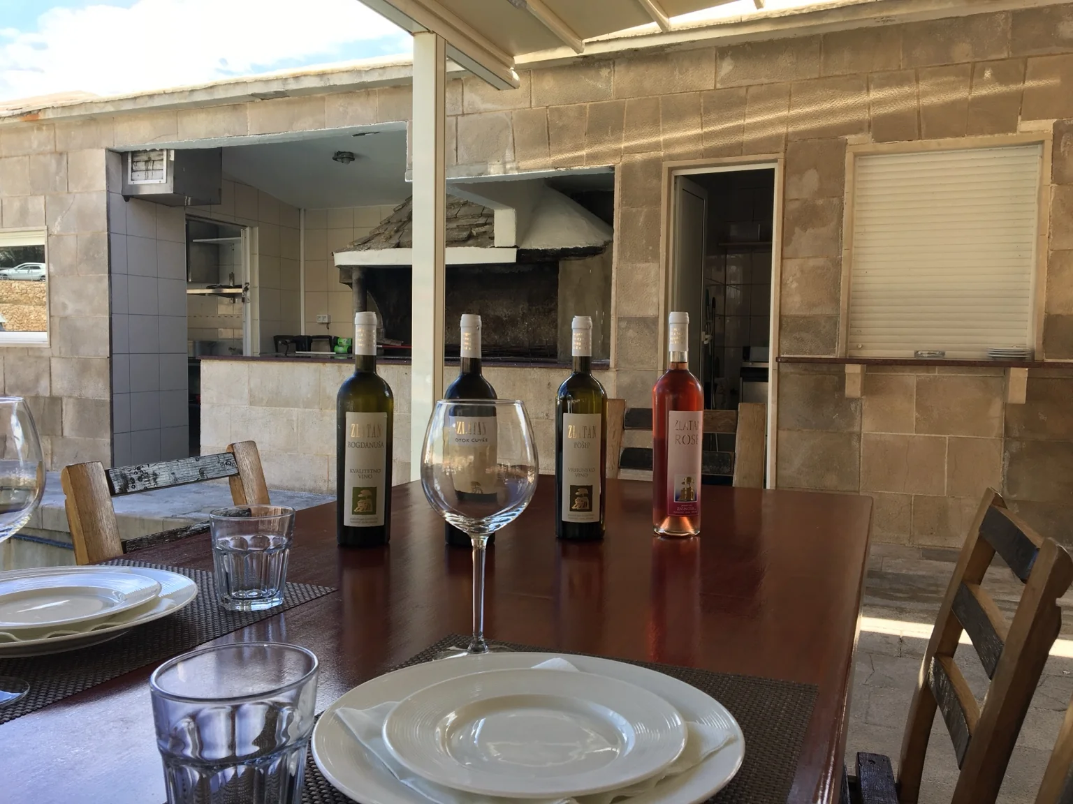 Croatian wines prepared on a table overlooking the sea