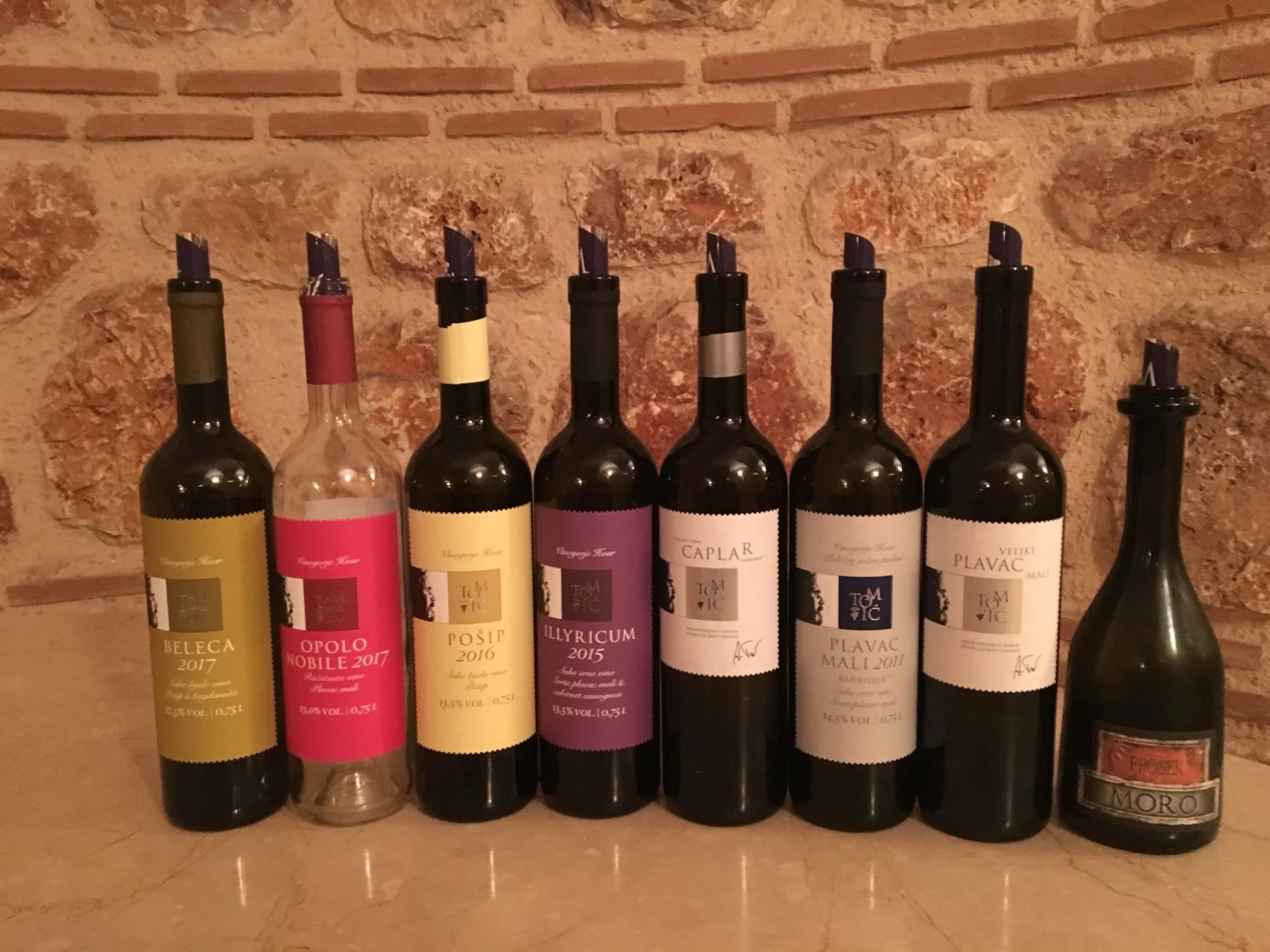 Selection of Croatian wine bottles at a tasting