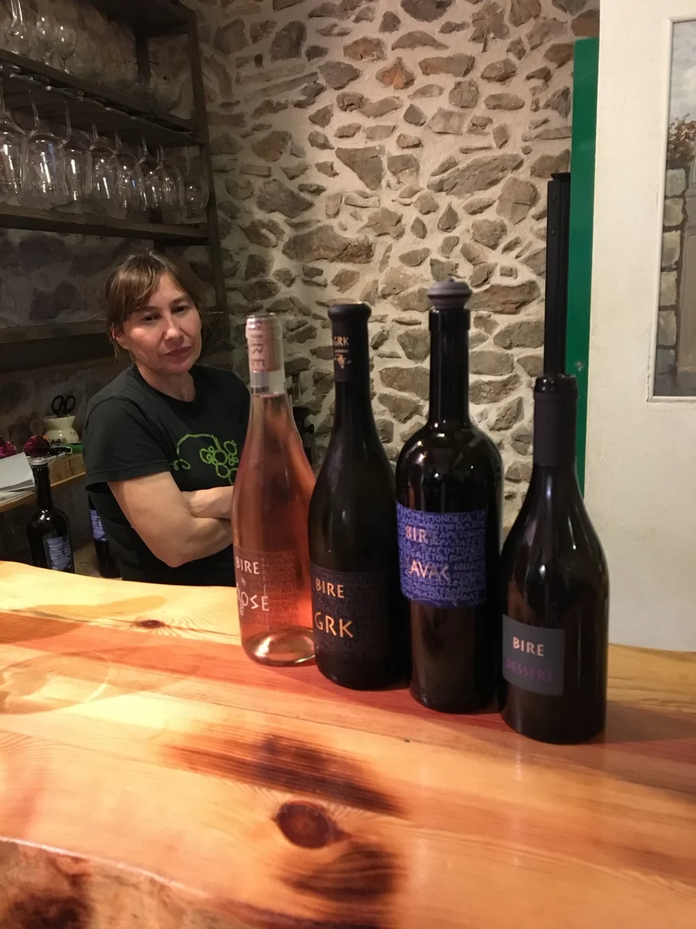 Wine producer presenting bottles during a hosted visit